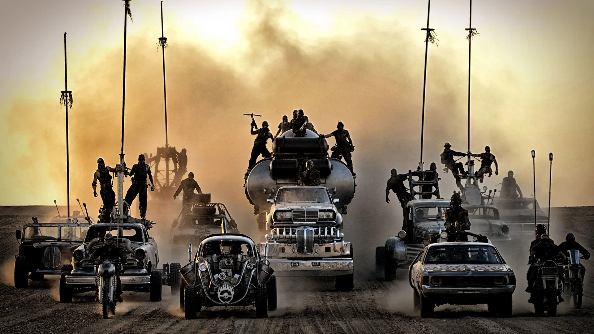 War vehicles racing across the desert in Mad Max: Fury Road (2015)